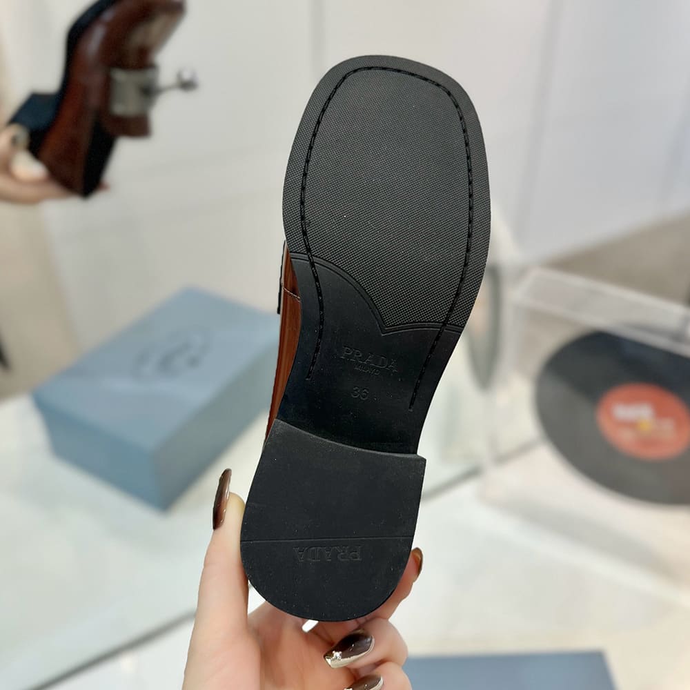 Pra*a Brushed leather loafers with metal details