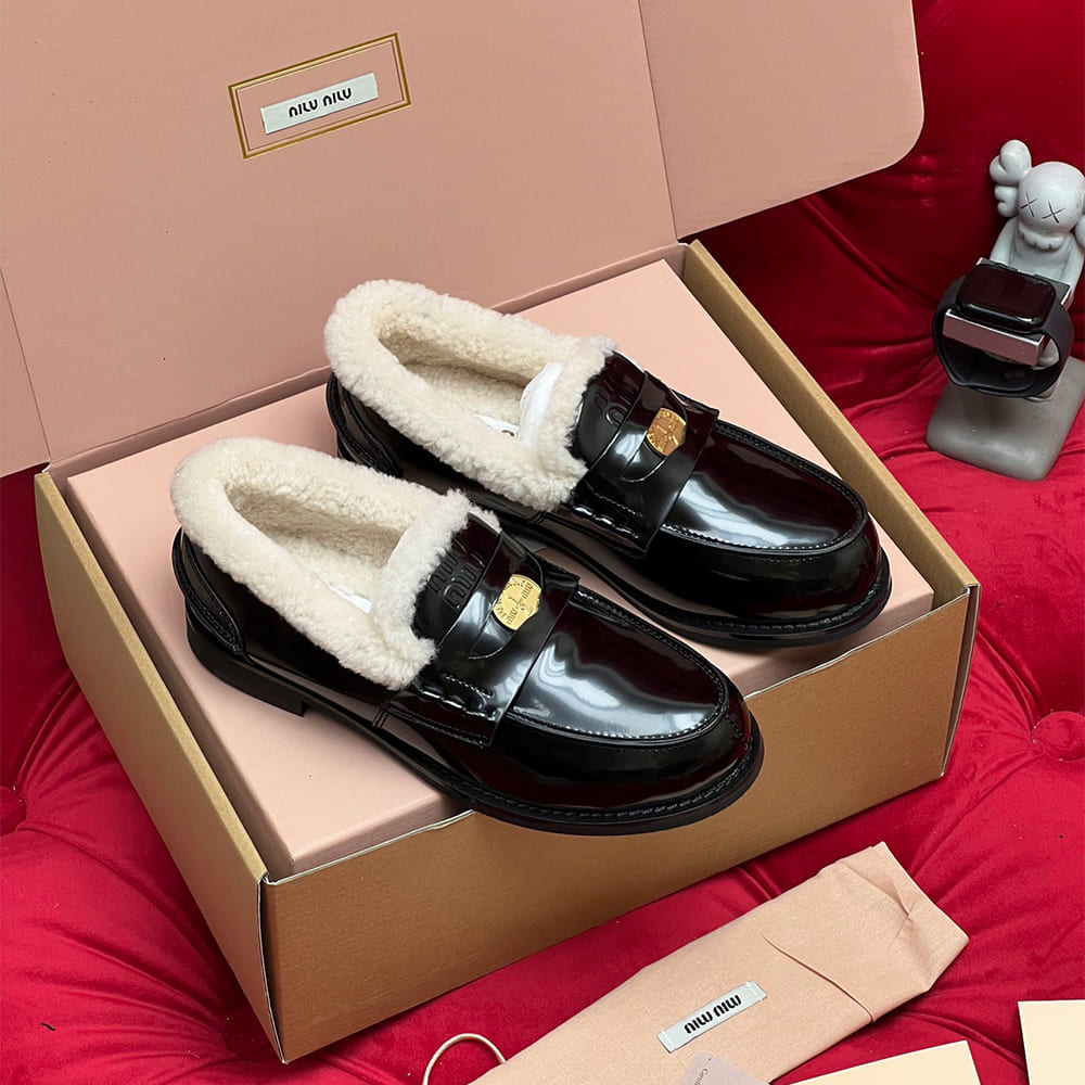 M1um1u Bleached leather and shearling penny loafers