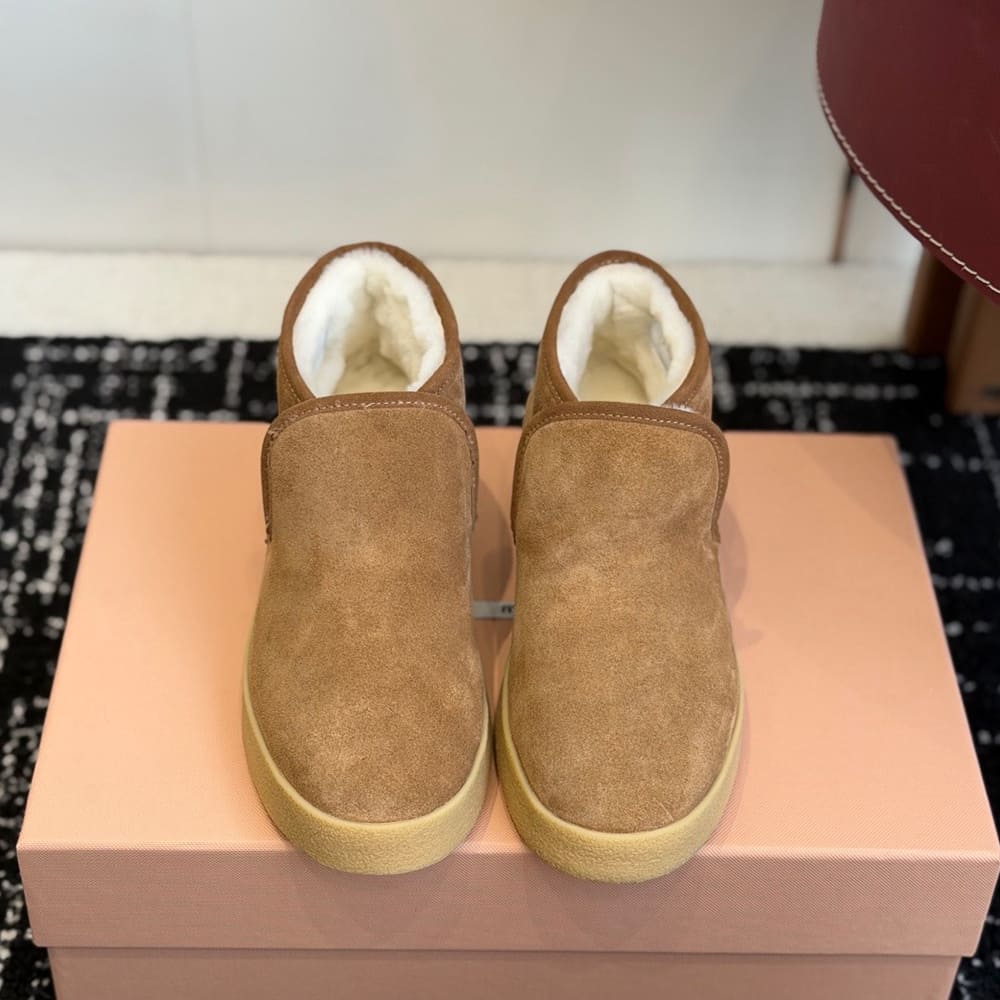 M1um1u Suede and shearling slip-on booties
