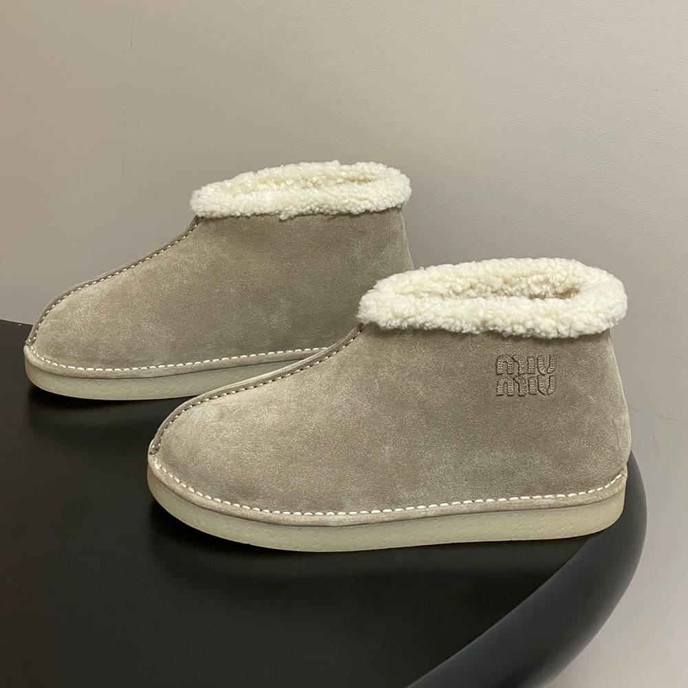 M1um1u Suede and shearling slip-on booties