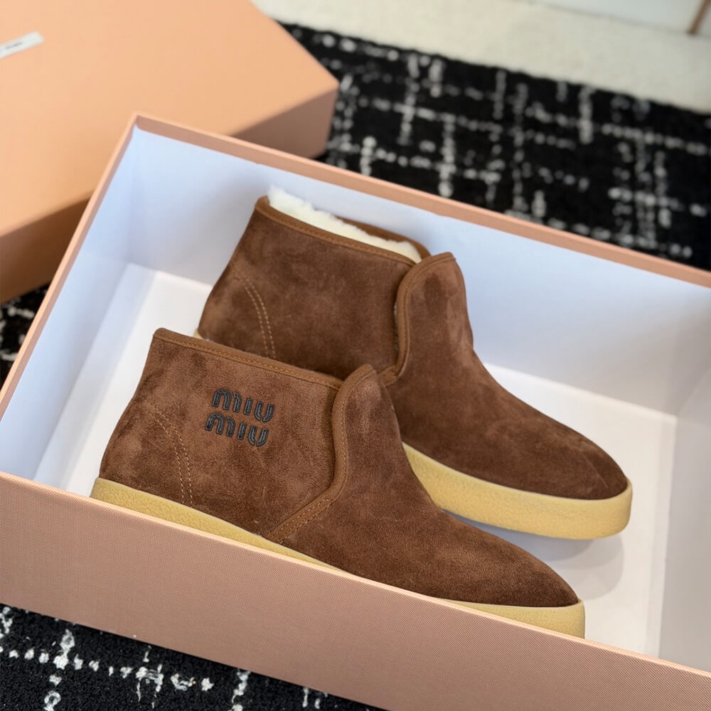 M1um1u Suede and shearling slip-on booties