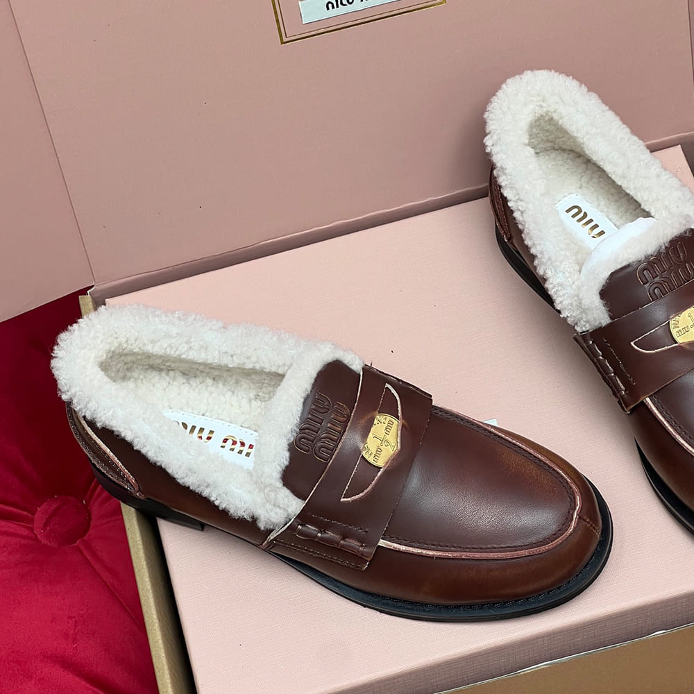 M1um1u Bleached leather and shearling penny loafers