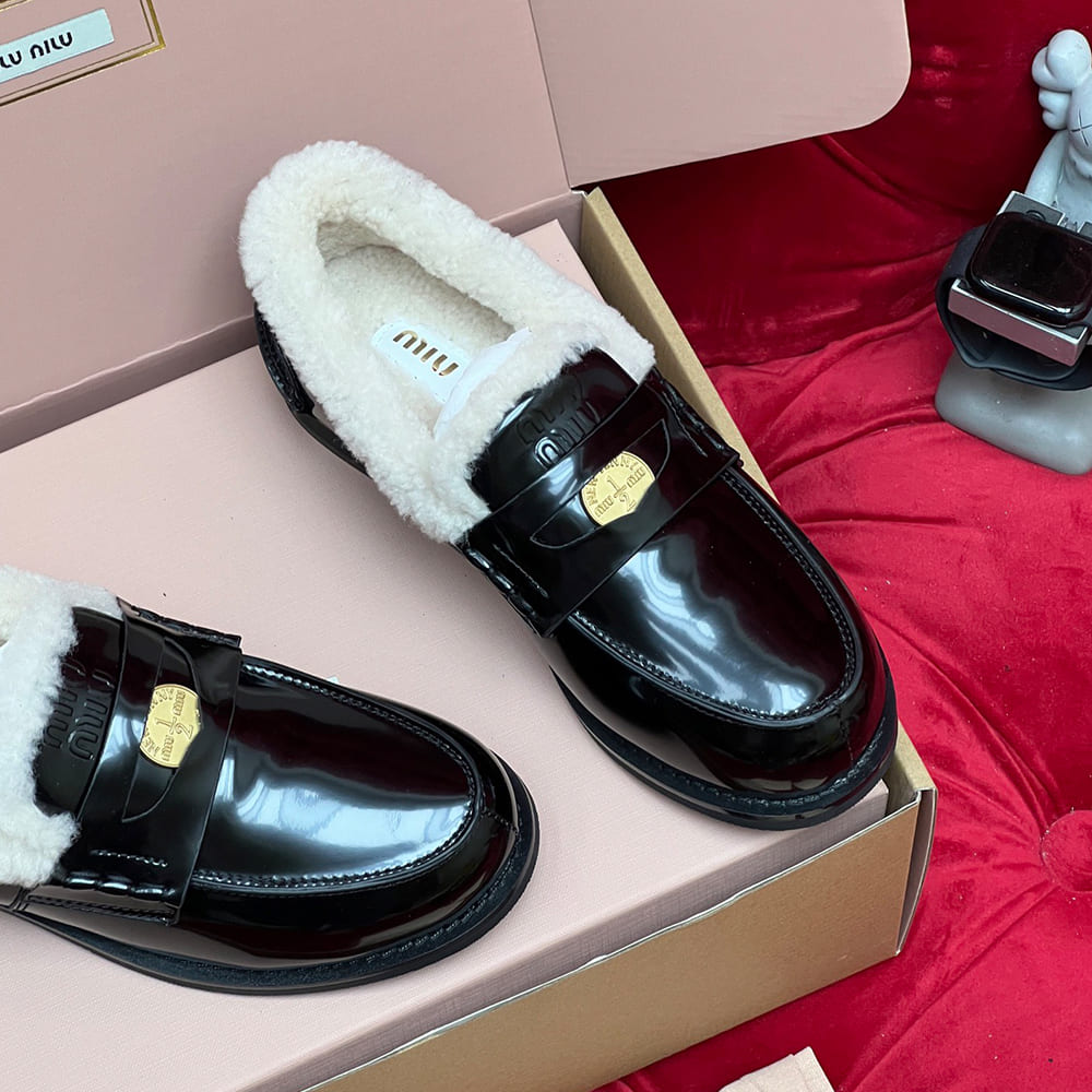 M1um1u Bleached leather and shearling penny loafers