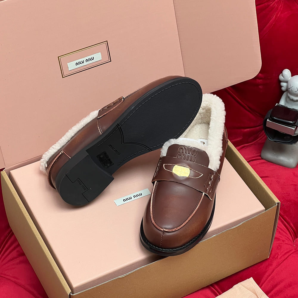 M1um1u Bleached leather and shearling penny loafers